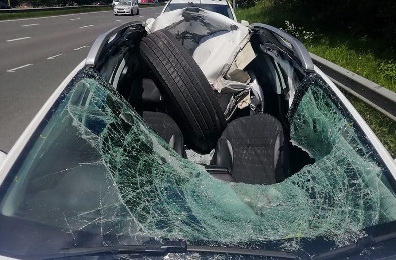 Shocking pictures show motorway miracle as driver escapes flying tyre smash